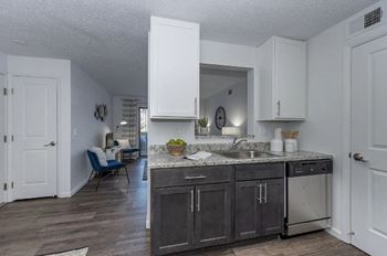 Kitchen area with wooden flooring and appliances at Mallard Landing, Marion, OH